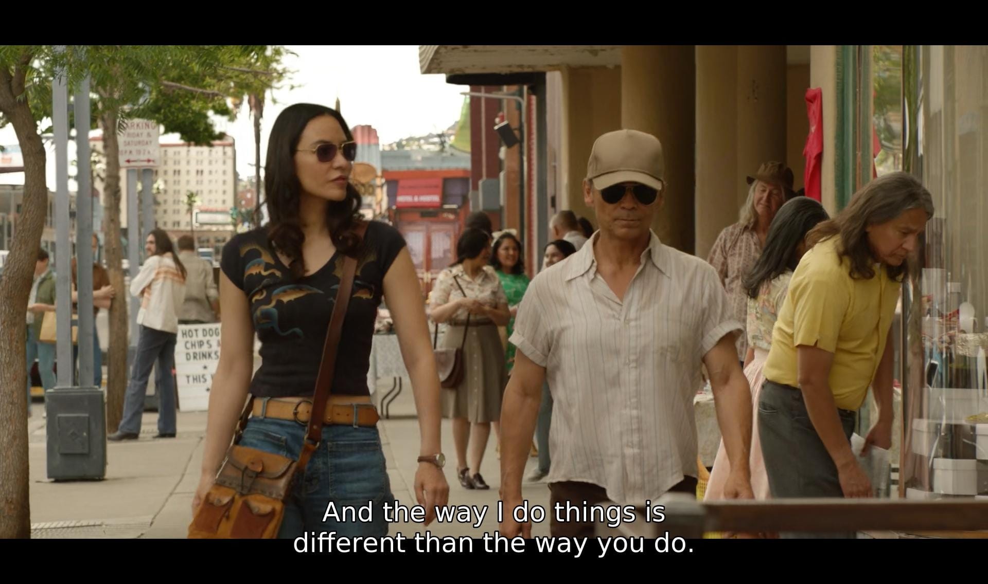 screenshot of dark winds featuring bern and leaphorn roaming the streets in l.a. bern says, "and the way i do things is different than the way you do."