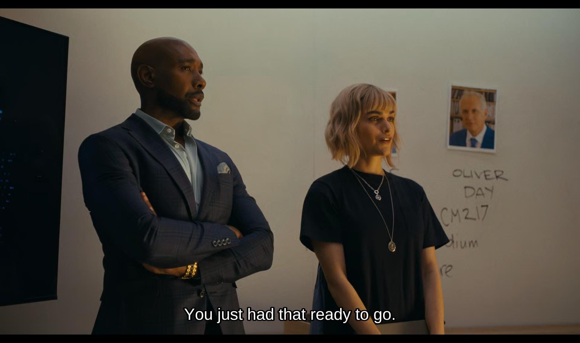 screenshot of watson featuring watson and ingrid standing in front of a white board inquiring their team mates