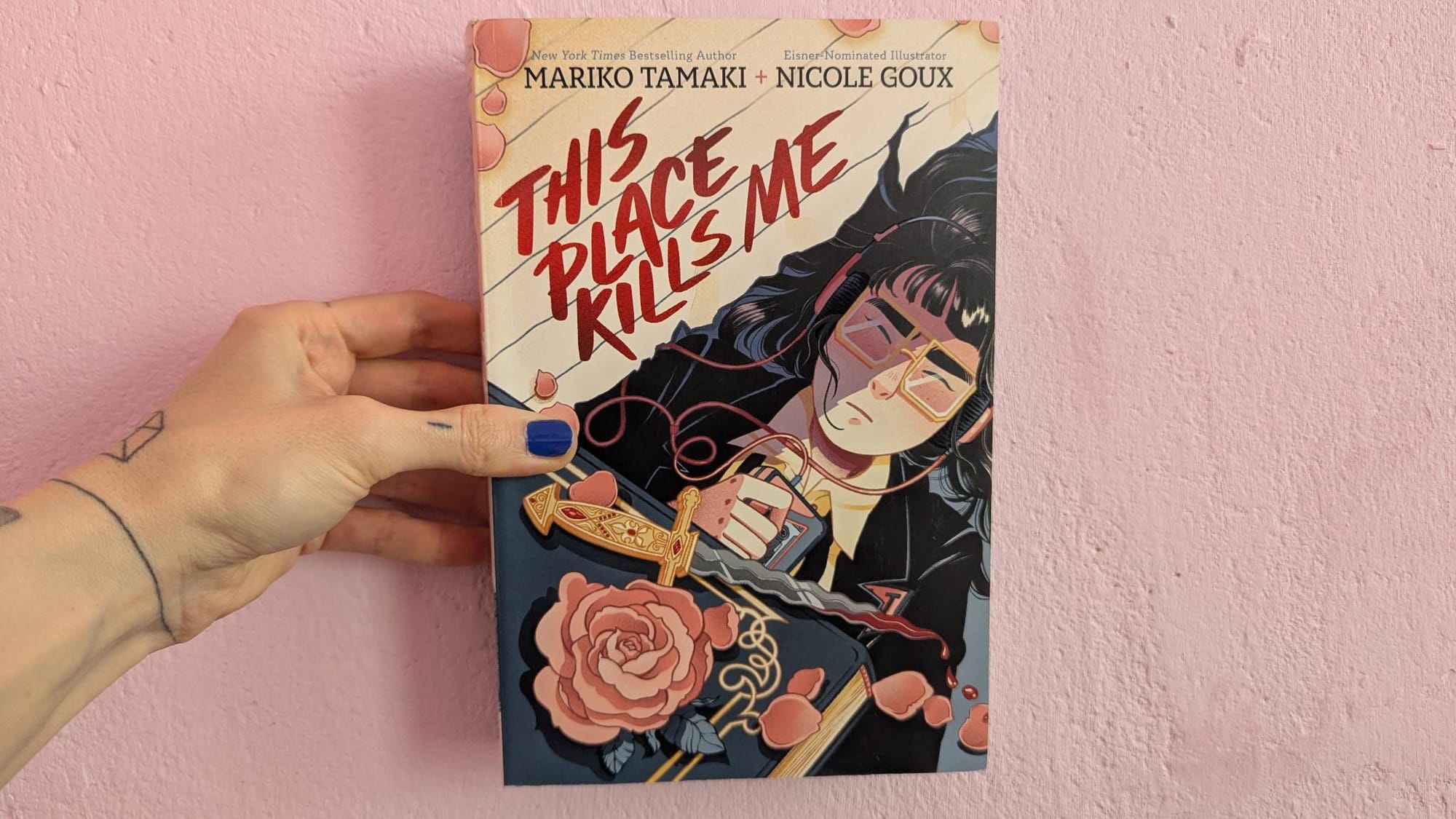 paperback of "this place kills me" by mariko tamaki & nicole goux with a hand-drawn cover