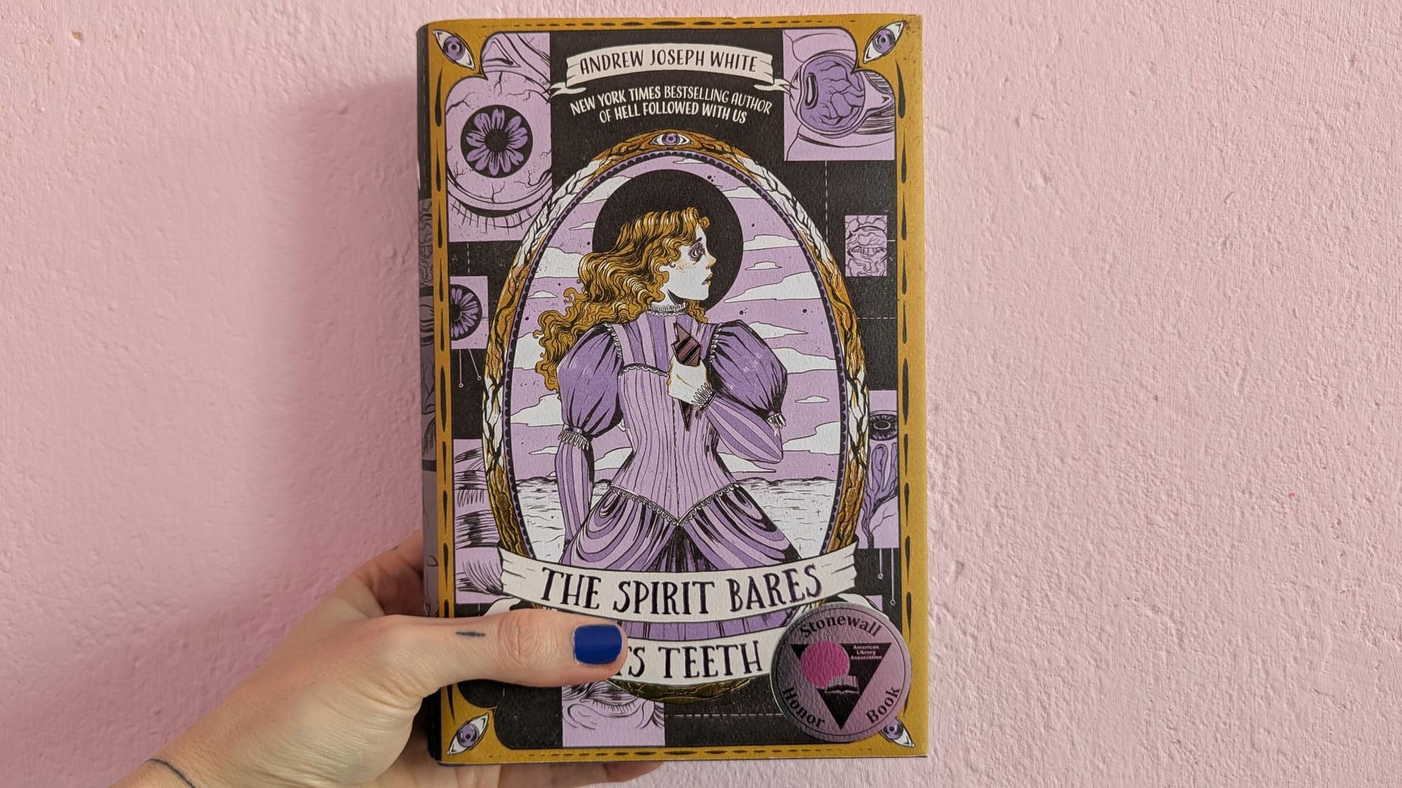 hard copy of "the spirit bares its teeth" by andrew joseph white featuring a beautiful hand-drawn illustration