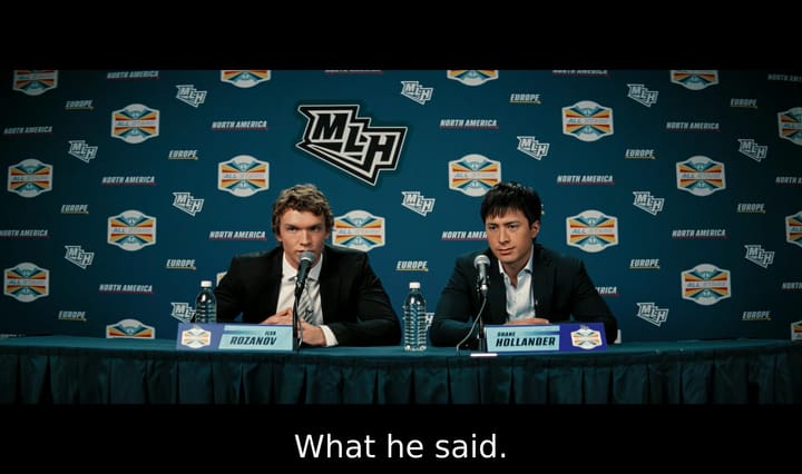 Screenshot of Ilya Rozanov and Shane Hollander holding a press conference. They're wearing suits and have a serious expression on their face. Rozanov says, "What he said."